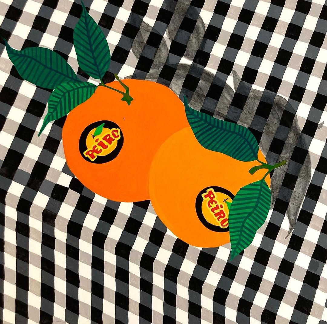 Oranges posées sur une nappe vichy noir et blanc